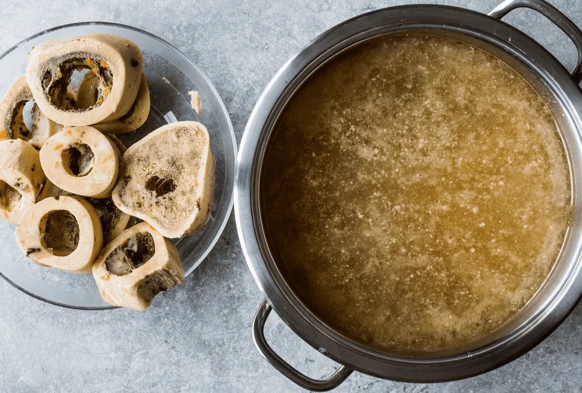 Cooking eggshells in broth for homemade dog food preparation